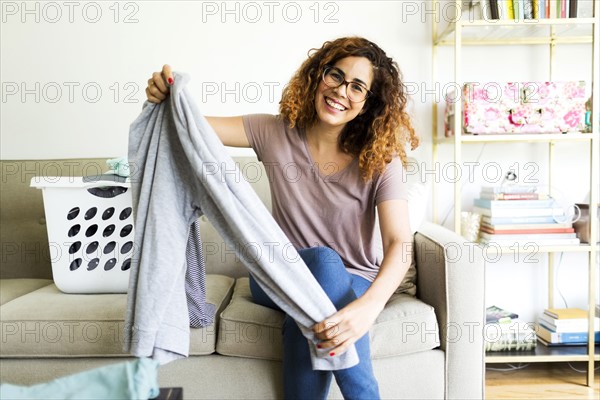 Woman holding trousers