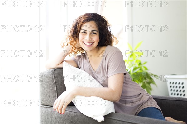 Woman sitting on sofa