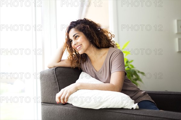 Woman sitting on sofa