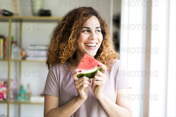 Woman holding water melon