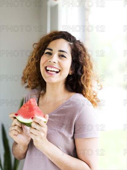 Woman holding water melon