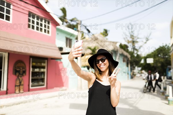 Woman photographing self