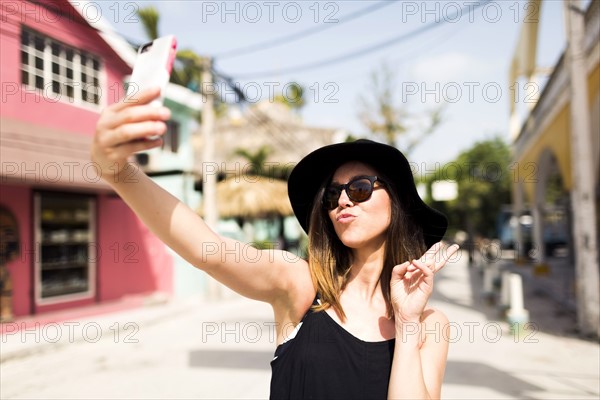 Woman photographing self