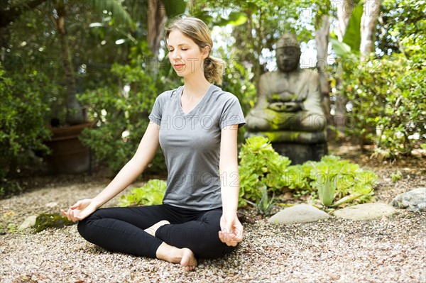 Woman meditating in park