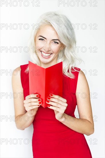 Studio shot of woman wearing red dress