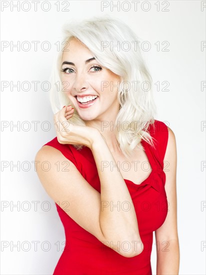 Studio shot of woman wearing red dress