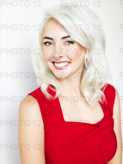 Studio shot of woman wearing red dress