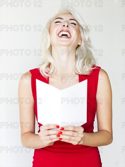 Studio shot of woman wearing red dress