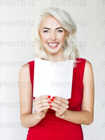 Studio shot of woman wearing red dress