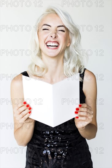 Studio shot of woman in black dress