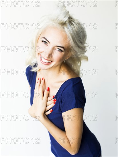 Studio shot of woman in blue dress