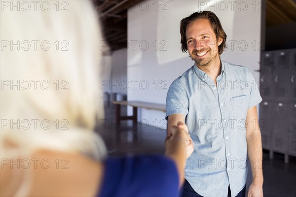 Man and woman shaking hands