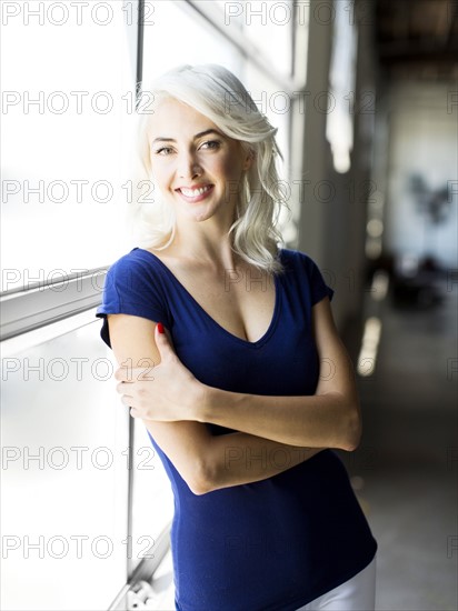 Woman standing by window