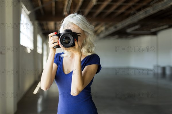 Woman using digital camera