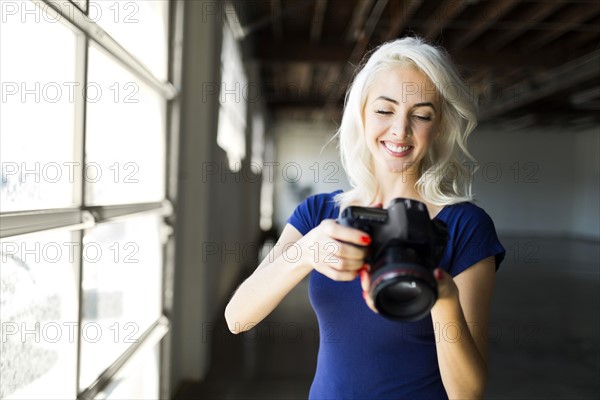 Woman using digital camera