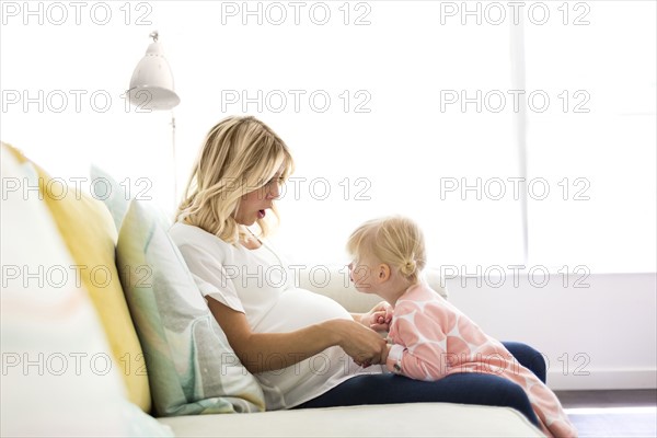 Mother spending time with daughter (2-3) at home