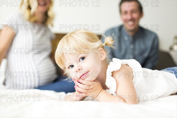 Portrait of girl (2-3) and parents