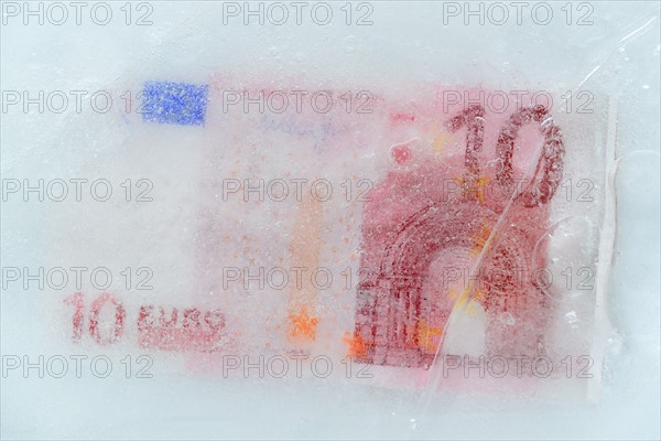 Studio Shot of 10 euro bill frozen in ice