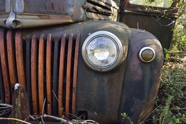 Front of rusty abandoned car