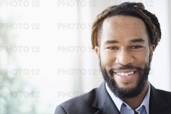 Portrait of smiley businessman wearing suit.