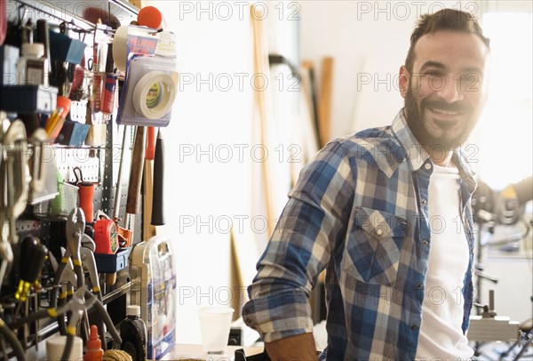 Portrait of man in workshop.