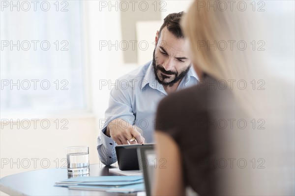 Man and woman working in office.