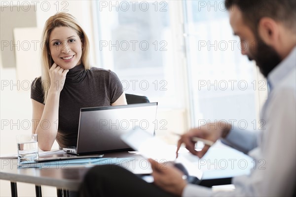 Man and woman working in office.