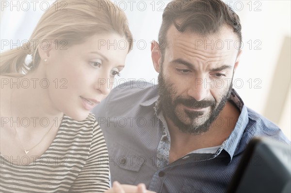 Man and woman looking at computer.