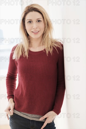 Portrait of young woman looking at camera.