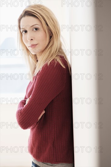 Portrait of young woman looking at camera.