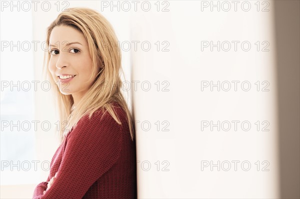 Portrait of young woman looking at camera.
