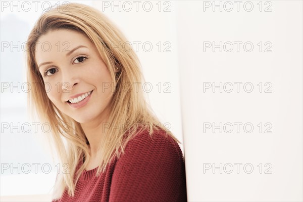 Portrait of young woman looking at camera.