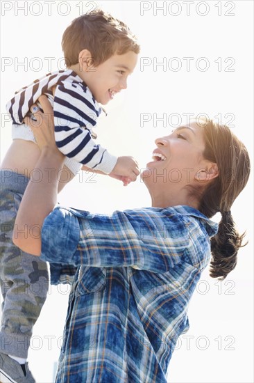 Woman playing with son (2-3).