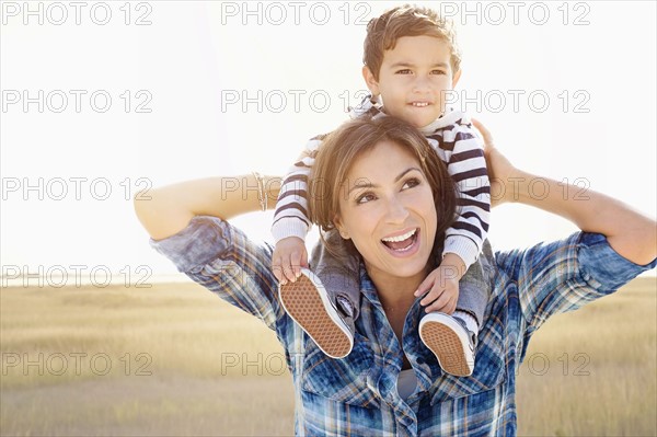 Woman playing with son (2-3).