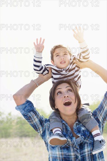 Woman playing with son (2-3).
