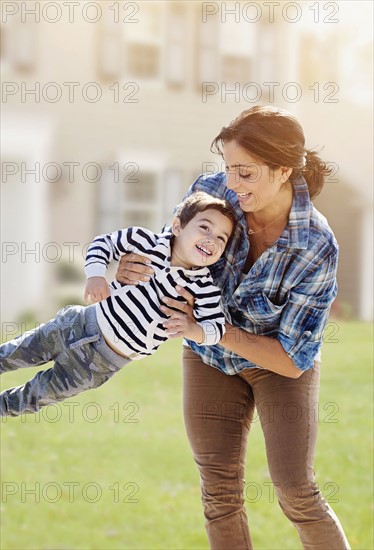 Woman playing with son (2-3).