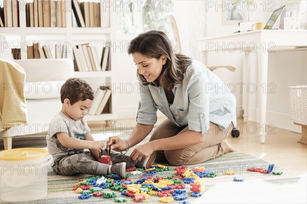 Mother playing with son (2-3).