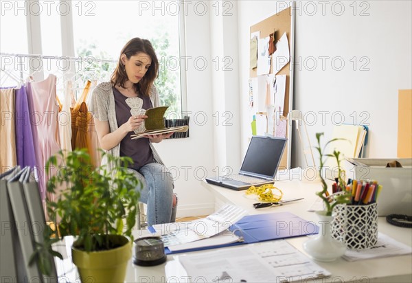 Female fashion designer in her office.