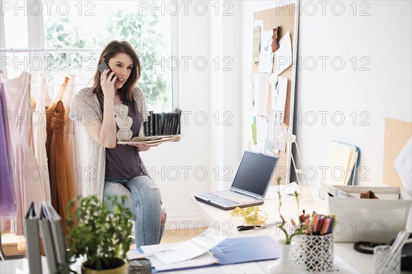 Female fashion designer in her office.