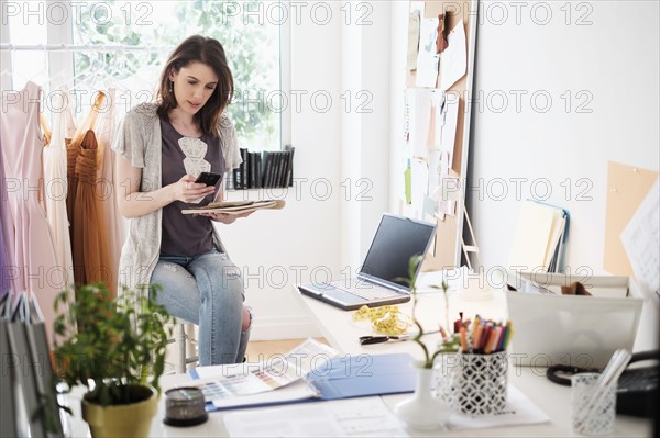 Female fashion designer in her office.