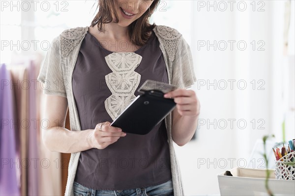 Female fashion designer in her office.