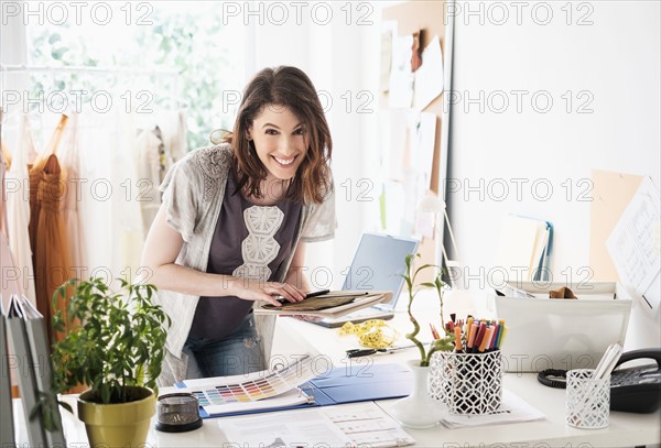 Female fashion designer in her office.