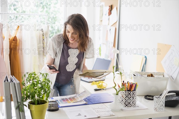 Female fashion designer in her office.