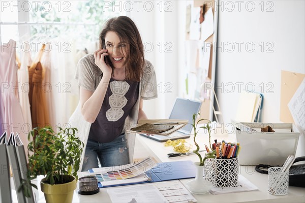 Young woman talking on phone.