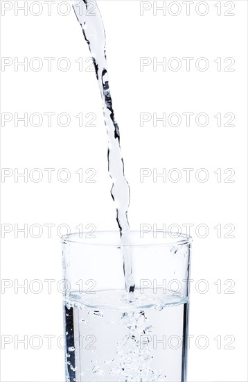 Studio shot of water pouring into glass.