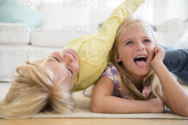 Boy (4-5) and girl (6-7) playing on floor