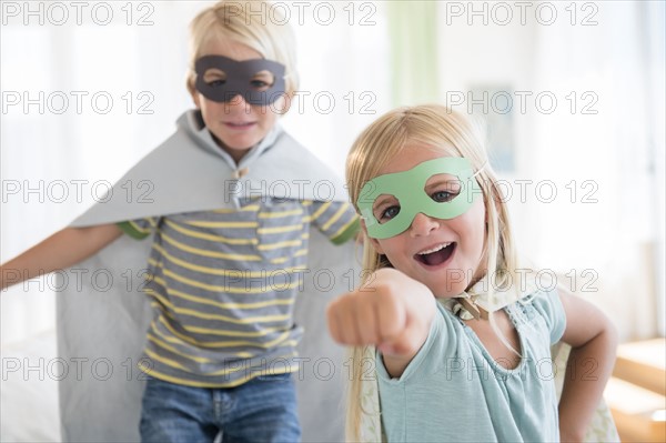 Boy (4-5) and girl (6-7) wearing masks