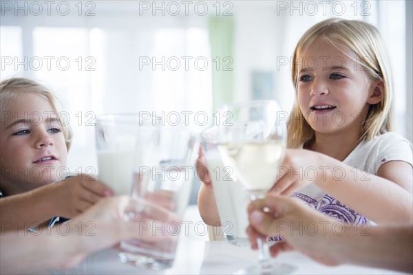 Family with son (4-5) and daughter (6-7) drinking refreshments