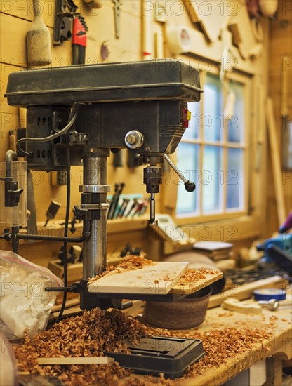 Woodworking drill in carpentry workshop