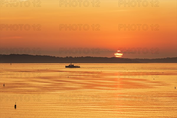 Lobstermen fishing in golden sunrise